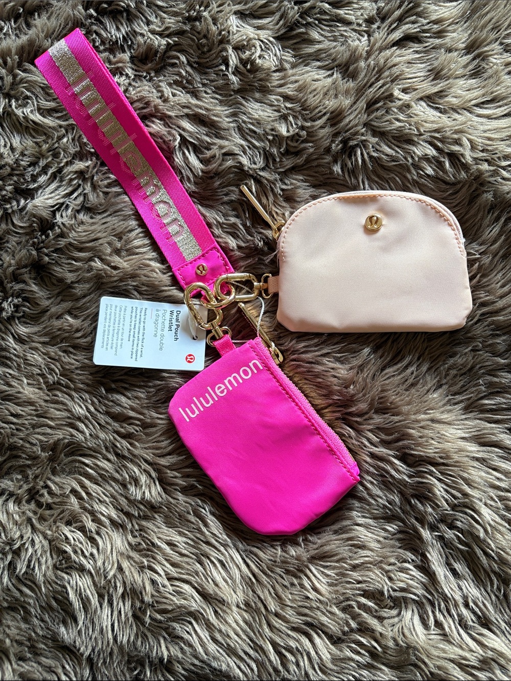 lululemon bright pink keychain pouch with gold hardware